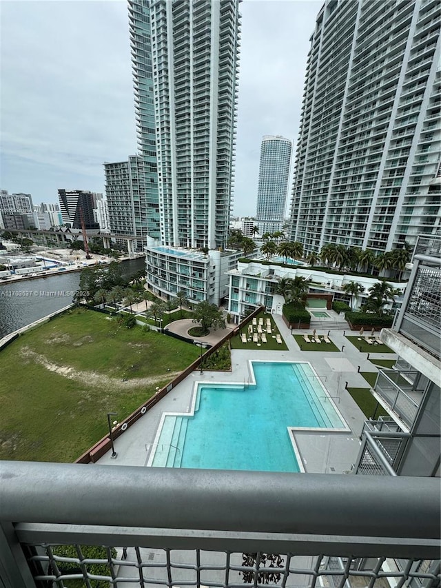 view of pool featuring a water view