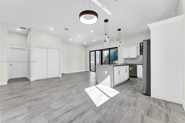 kitchen featuring a center island, white cabinets, decorative backsplash, decorative light fixtures, and stainless steel appliances