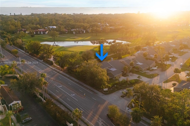 aerial view at dusk with a water view