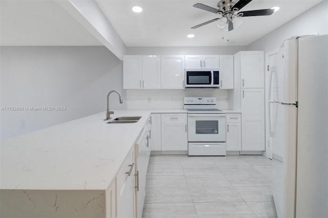 kitchen featuring light stone countertops, sink, ceiling fan, white appliances, and white cabinets