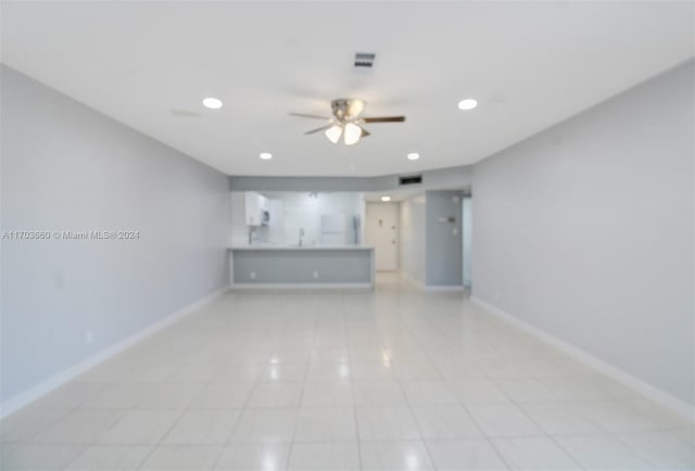 2251 NW 48th Ter Unit 208, Lauderhill, FL 33313 - unfurnished living room featuring light tile patterned floors, ceiling fan, baseboards, recessed lighting, and a sink