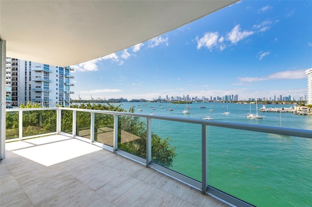 balcony featuring a water view