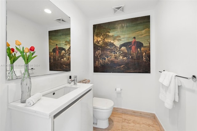 1470 16th St Unit 501, Miami Beach, FL 33139 - half bath with vanity, wood finished floors, and recessed lighting