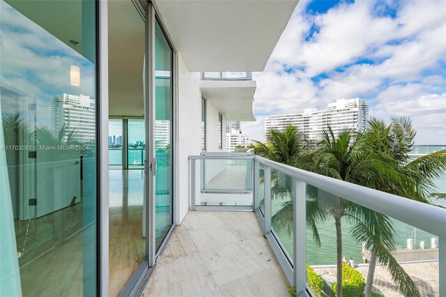 balcony featuring a water view