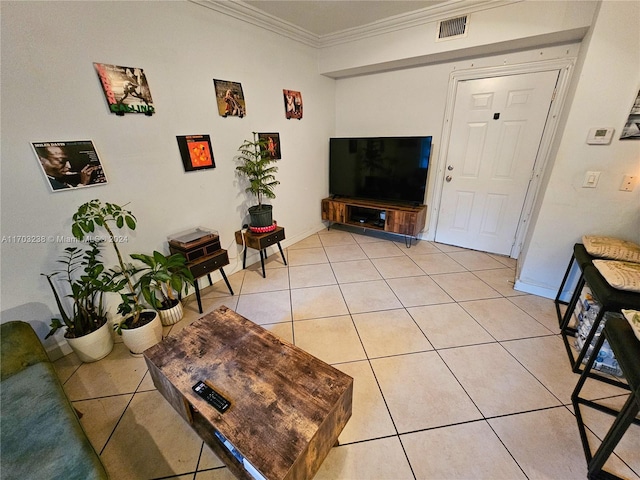 living room featuring ornamental molding and light tile patterned floors