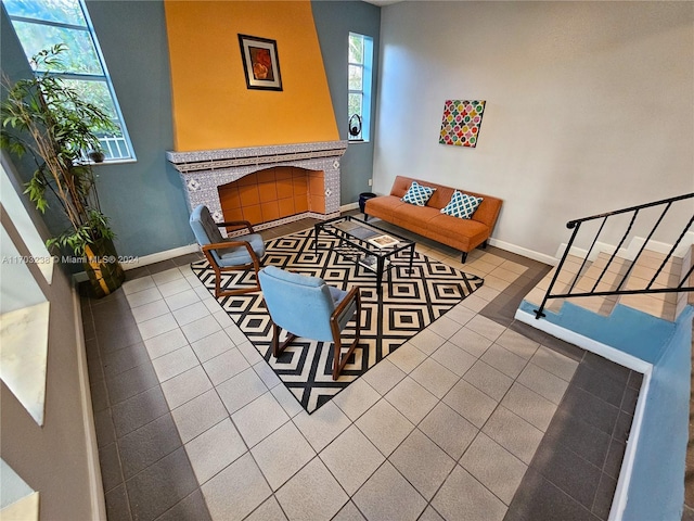 living area featuring tile patterned flooring and a fireplace