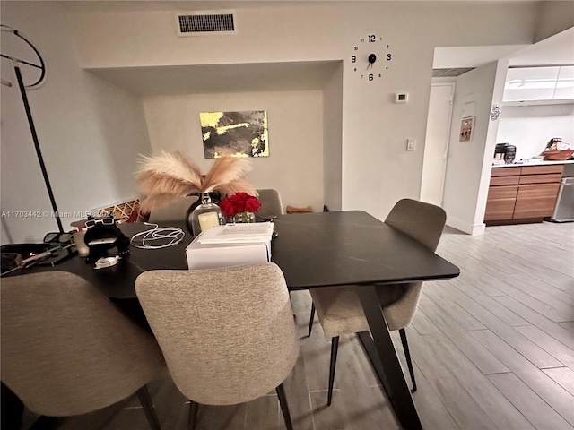 dining space featuring light hardwood / wood-style flooring