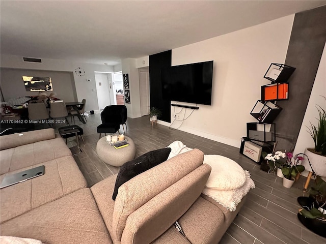 living room with dark hardwood / wood-style flooring