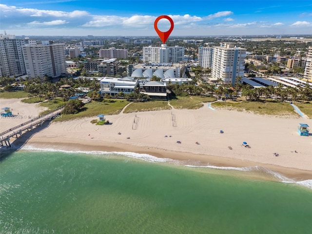 bird's eye view with a view of the beach and a water view