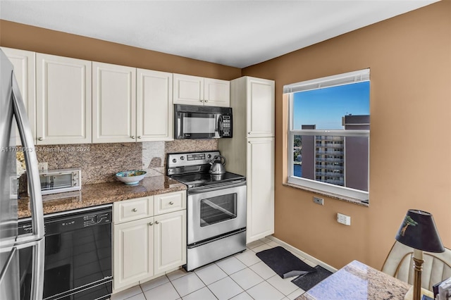 kitchen with white cabinets, decorative backsplash, dark stone counters, and black appliances