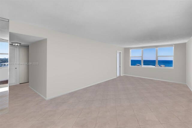 bedroom with ceiling fan, light hardwood / wood-style floors, and a water view