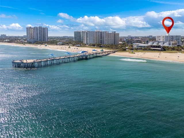 bird's eye view with a water view and a view of the beach