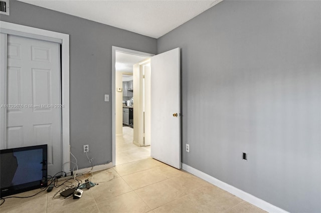 interior space with light tile patterned floors