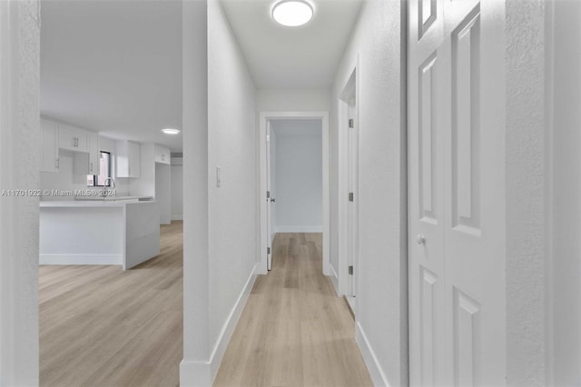 hall featuring light hardwood / wood-style flooring