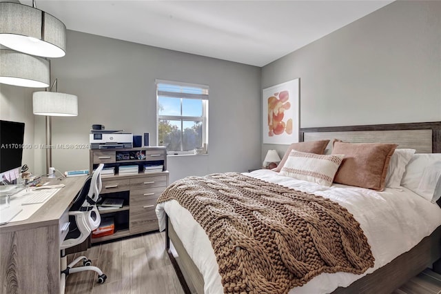 bedroom with light hardwood / wood-style floors