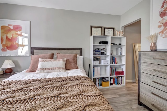 bedroom with light wood-type flooring