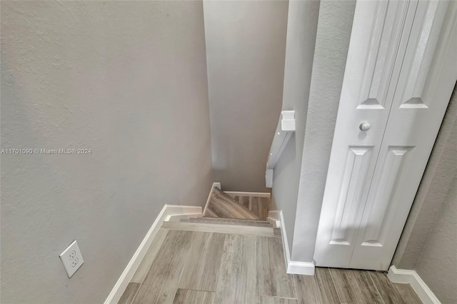 stairway featuring hardwood / wood-style flooring