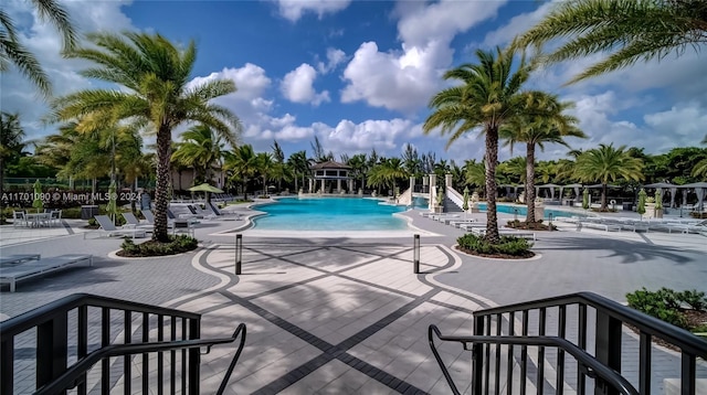 view of swimming pool with a patio area