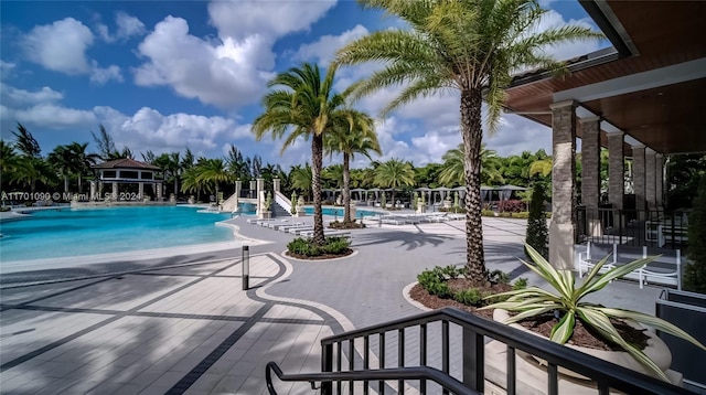 view of swimming pool with a patio area