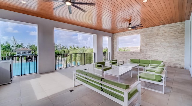 view of patio / terrace featuring ceiling fan and an outdoor hangout area