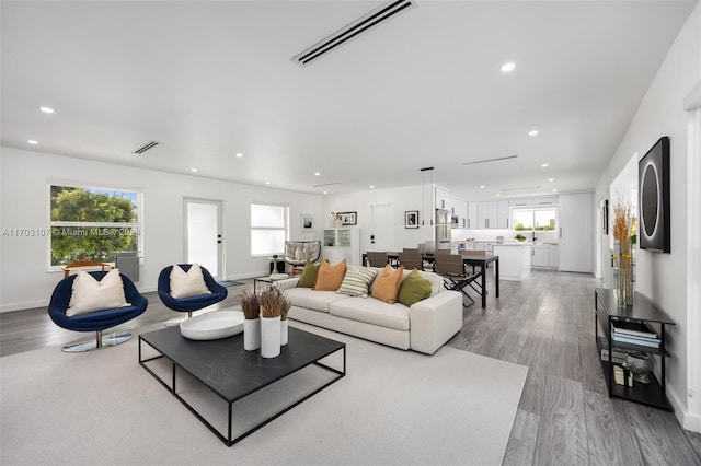 living room with light hardwood / wood-style flooring