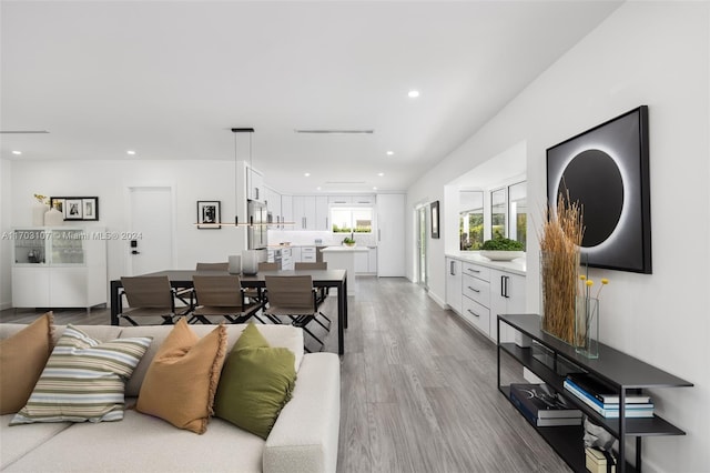 living room with light hardwood / wood-style flooring