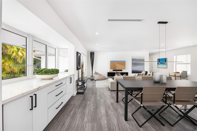 dining space with hardwood / wood-style flooring