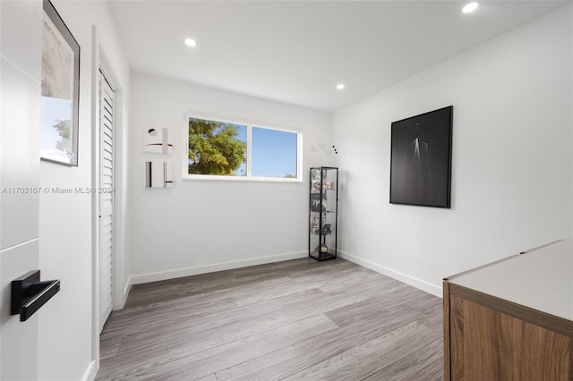 spare room featuring light wood-type flooring