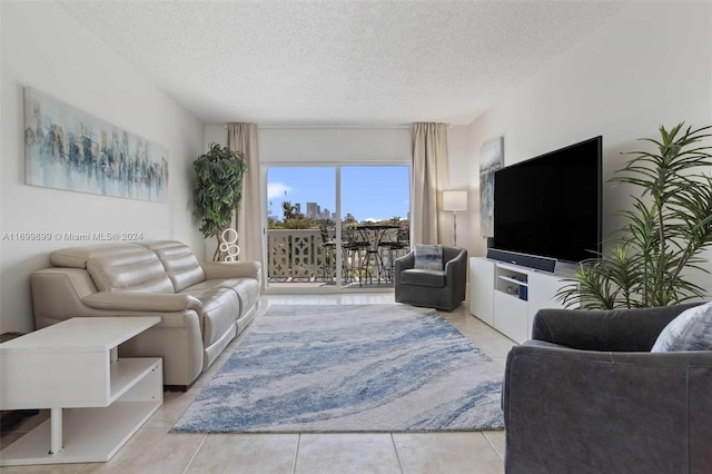 tiled living room with a textured ceiling