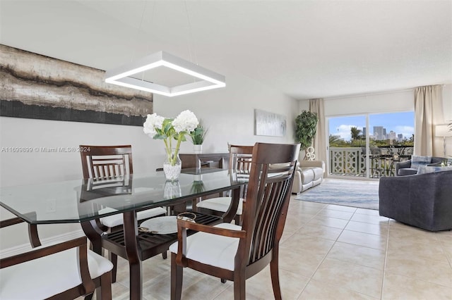 dining space with light tile patterned flooring