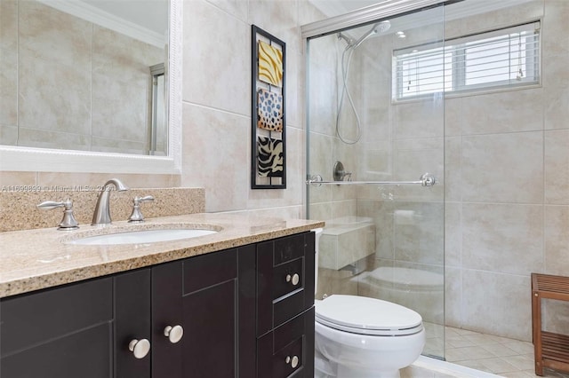 bathroom featuring crown molding, a shower with door, vanity, and toilet