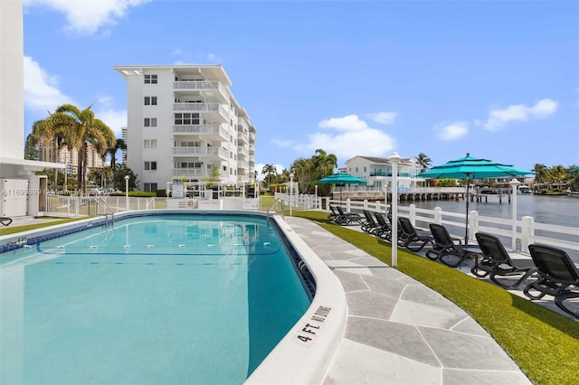 view of swimming pool featuring a water view