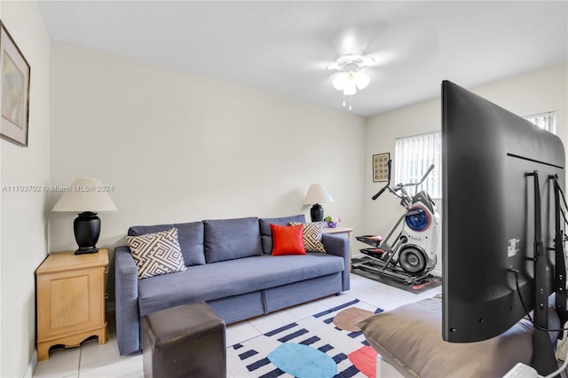 living room with light tile patterned floors and ceiling fan