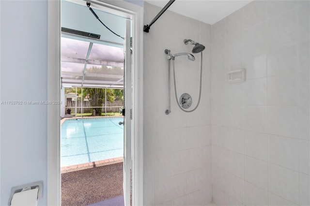 bathroom with a tile shower