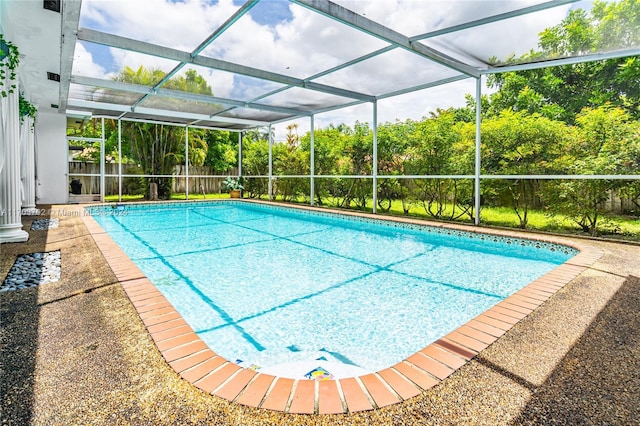 view of swimming pool with a lanai