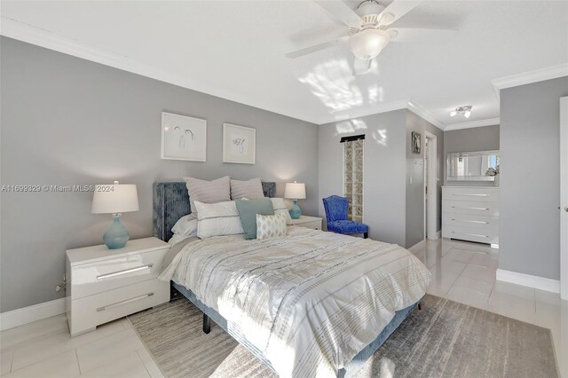 bedroom featuring ceiling fan, crown molding, and light tile patterned floors