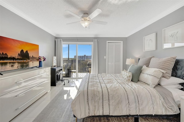 tiled bedroom with access to exterior, ceiling fan, crown molding, a textured ceiling, and a closet