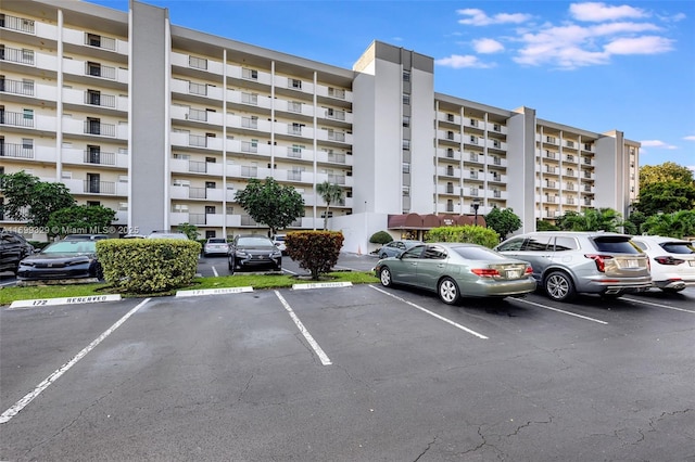 view of property with uncovered parking