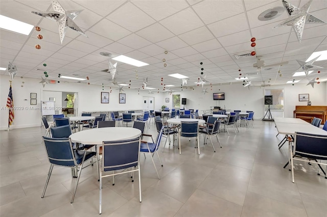 dining space featuring a paneled ceiling and visible vents