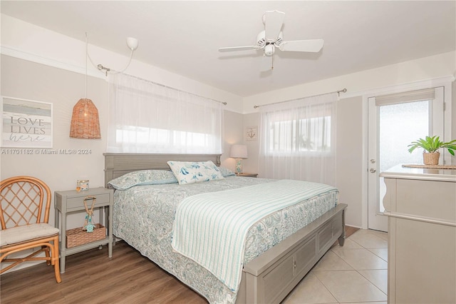 bedroom with ceiling fan and light wood-type flooring