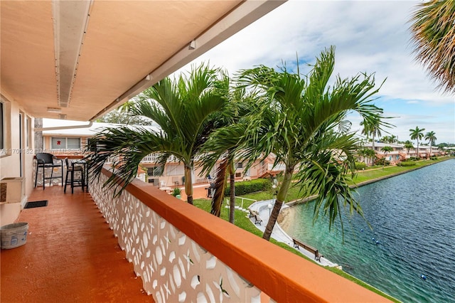 balcony featuring a water view