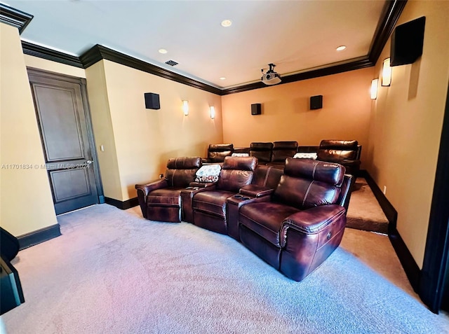 carpeted home theater with crown molding