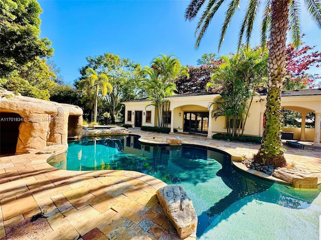 view of swimming pool with a patio area