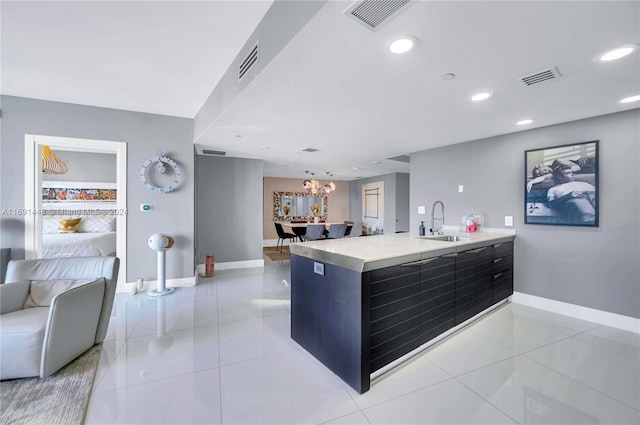 kitchen featuring sink and light tile patterned floors