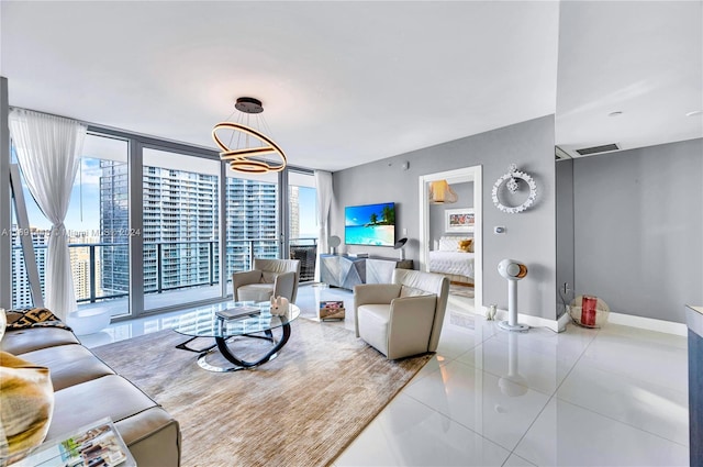 tiled living room featuring a wall of windows