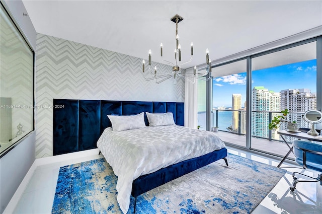 tiled bedroom featuring access to exterior and a water view