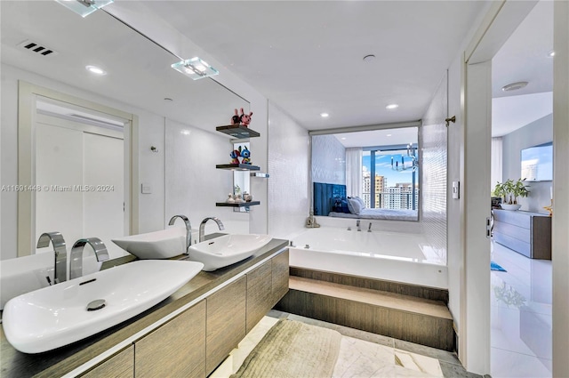 bathroom with tile patterned flooring and vanity