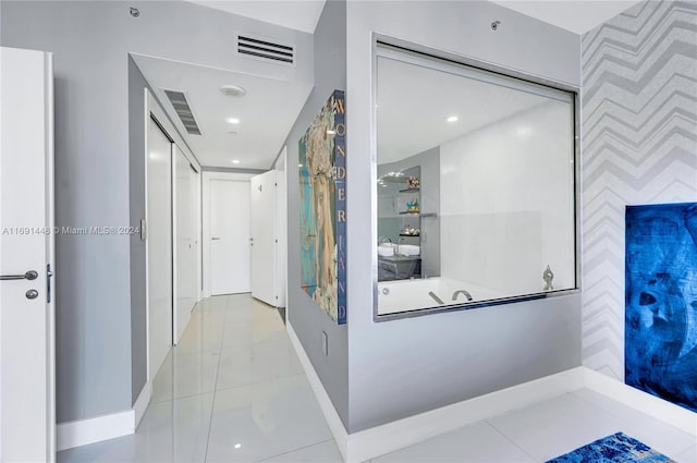 hallway with light tile patterned floors