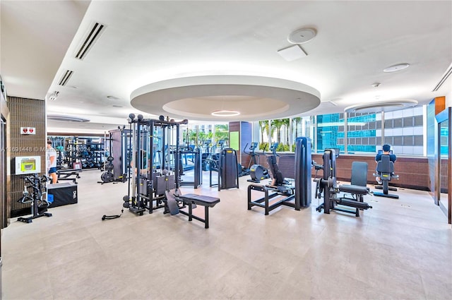 exercise room featuring floor to ceiling windows