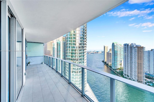 balcony featuring a water view